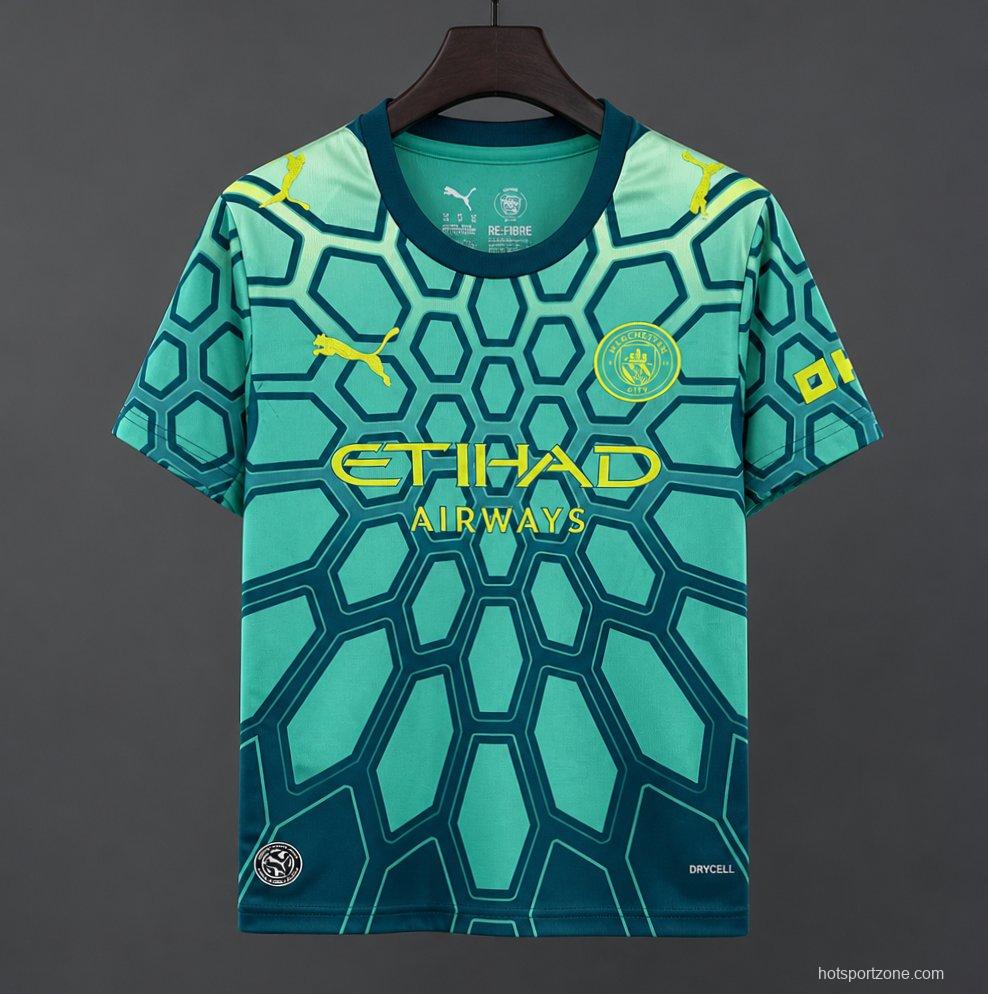 26/27 Manchester City Vibrant Green Goalkeeper Jersey With Dark Blue Geometric Pattern.
